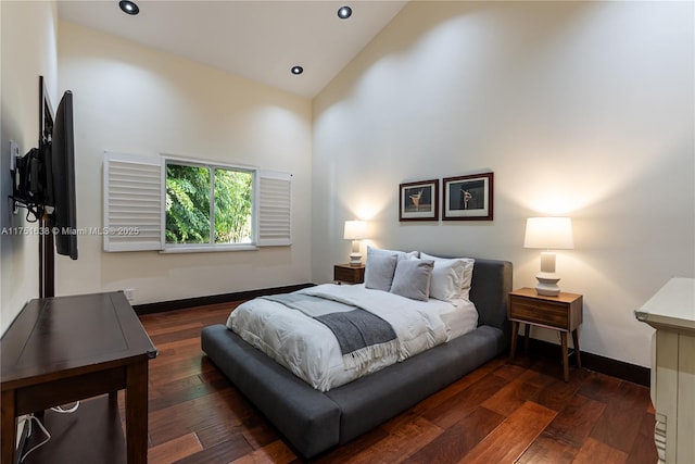 bedroom with high vaulted ceiling, recessed lighting, baseboards, and hardwood / wood-style floors