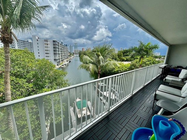 balcony with a view of city and a water view