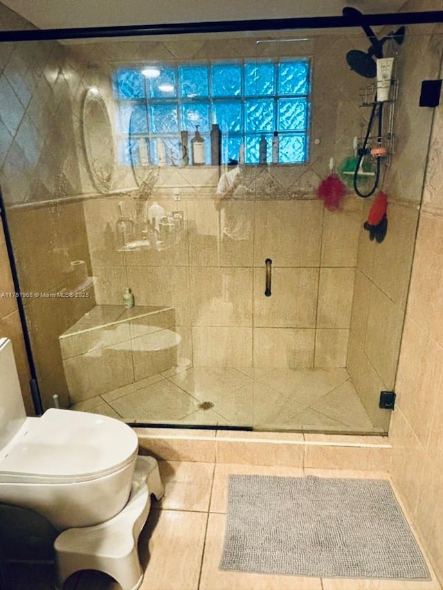 full bath with toilet and a shower stall