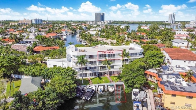 aerial view featuring a water view and a city view