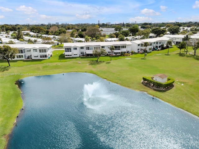 drone / aerial view with a water view and a residential view