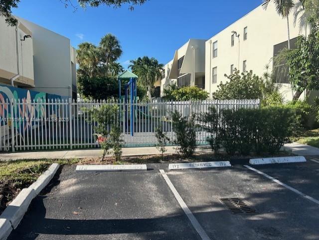 exterior space with playground community and fence