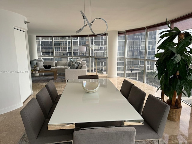 2025 Brickell Ave Unit 901, Miami, FL 33129 - dining area with expansive windows, healthy amount of natural light, and a chandelier