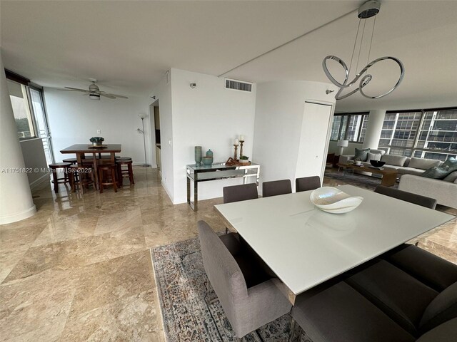 2025 Brickell Ave Unit 901, Miami, FL 33129 - dining area with ceiling fan and baseboards