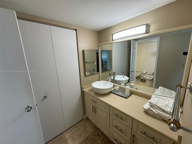 2025 Brickell Ave Unit 901, Miami, FL 33129 - bathroom with a bidet, vanity, and toilet
