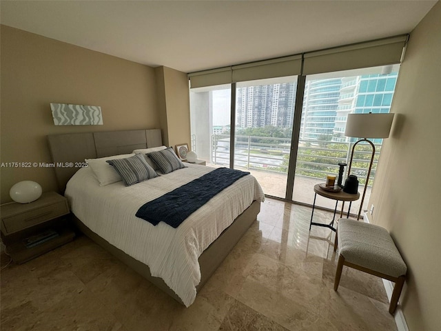 2025 Brickell Ave Unit 901, Miami, FL 33129 - bedroom with a wall of windows, access to exterior, and marble finish flooring