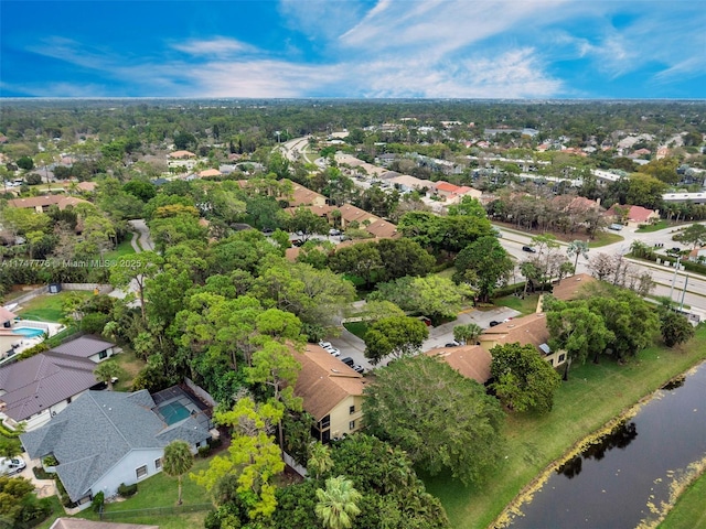 birds eye view of property featuring a residential view and a water view