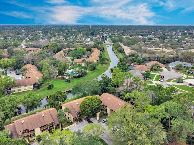 drone / aerial view featuring a residential view and a water view