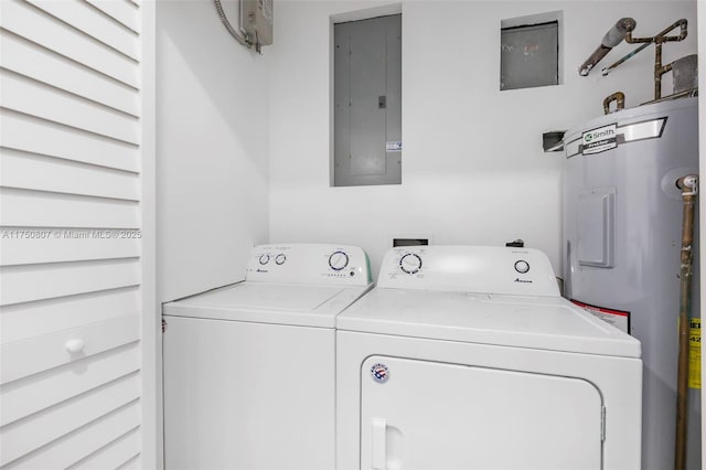 laundry room with laundry area, electric panel, electric water heater, and separate washer and dryer