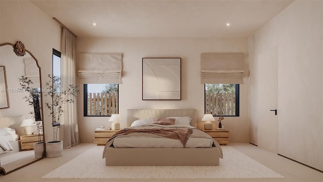 bedroom with carpet and multiple windows