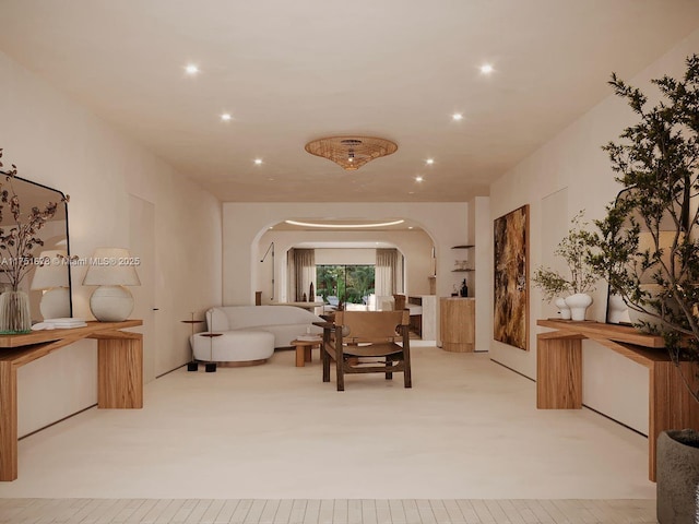 interior space featuring arched walkways and recessed lighting