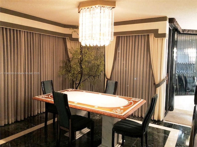 dining space with a notable chandelier