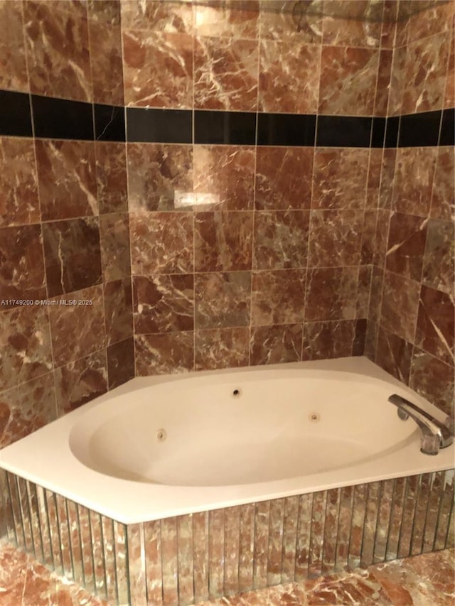 full bathroom featuring a whirlpool tub