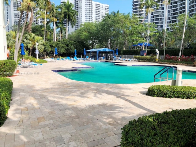 pool featuring a gazebo and a patio