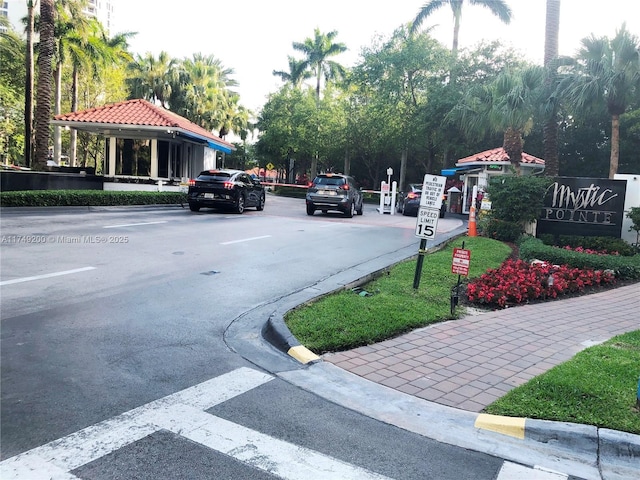 view of street with traffic signs and curbs