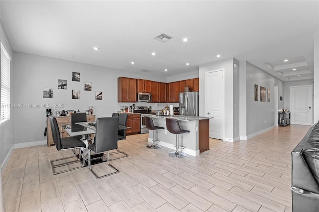 dining area with recessed lighting, visible vents, light wood finished floors, and baseboards