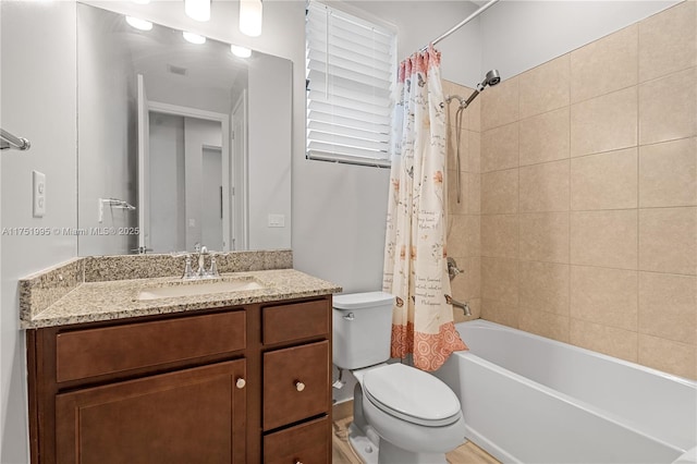 bathroom featuring toilet, visible vents, shower / bath combination with curtain, and vanity