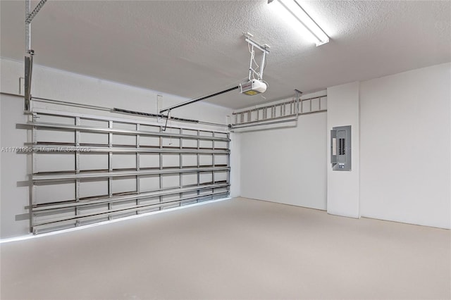 garage with electric panel and a garage door opener