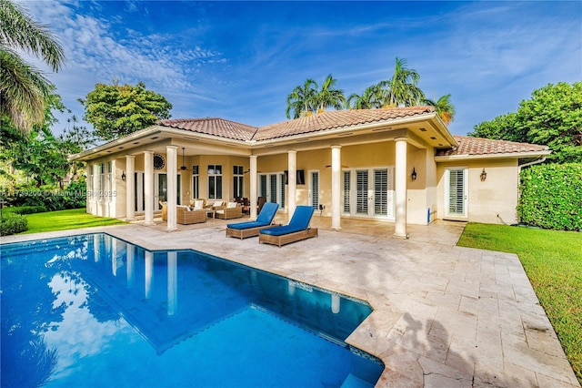 16721 SW 86th Ct, Palmetto Bay, FL 33157 - rear view of property with a tiled roof, an outdoor living space, stucco siding, and a patio