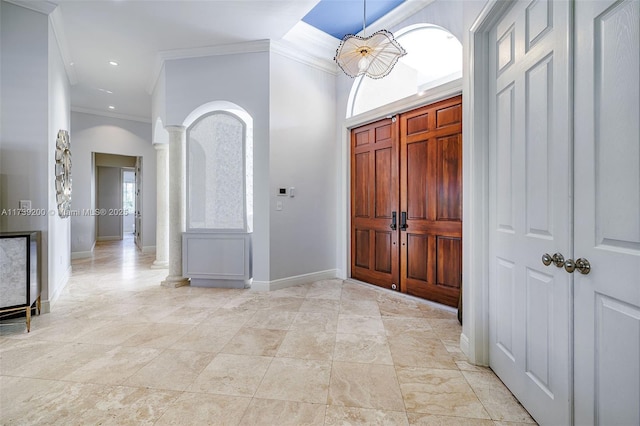 16721 SW 86th Ct, Palmetto Bay, FL 33157 - foyer featuring ornate columns, crown molding, baseboards, arched walkways, and recessed lighting
