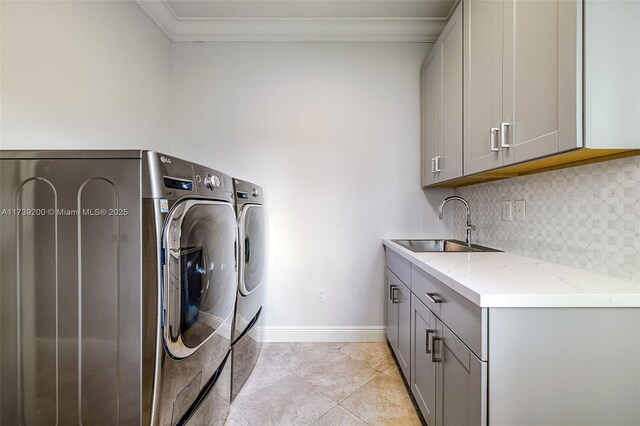 16721 SW 86th Ct, Palmetto Bay, FL 33157 - washroom with cabinet space, independent washer and dryer, crown molding, baseboards, and light tile patterned floors