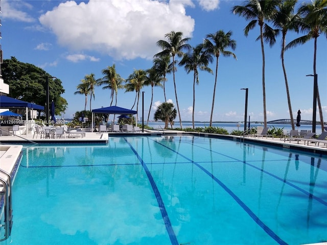 community pool with a patio and a gazebo