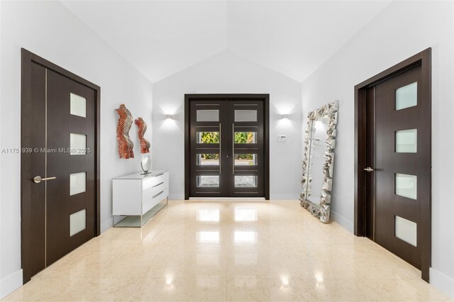 6784 SW 97th St, Pinecrest, FL 33156 - foyer featuring french doors, lofted ceiling, and baseboards