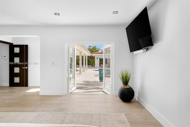 6784 SW 97th St, Pinecrest, FL 33156 - unfurnished living room with light wood-style floors and baseboards