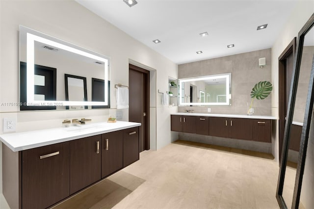 6784 SW 97th St, Pinecrest, FL 33156 - full bathroom featuring two vanities and wood finished floors