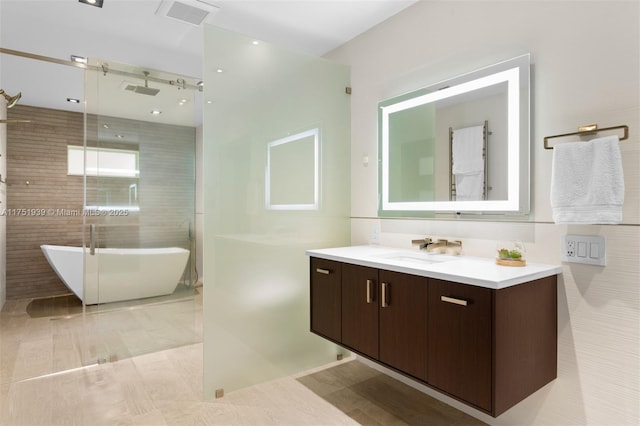 6784 SW 97th St, Pinecrest, FL 33156 - bathroom with a shower with shower door, vanity, and a soaking tub