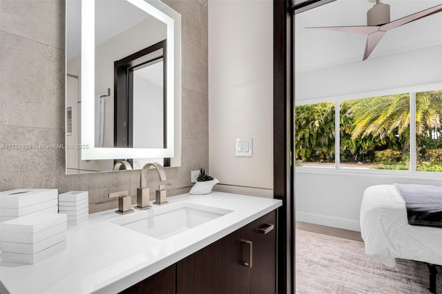 6784 SW 97th St, Pinecrest, FL 33156 - bathroom featuring vanity, wood finished floors, ceiling fan, and baseboards