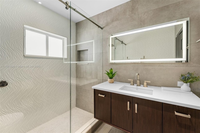 6784 SW 97th St, Pinecrest, FL 33156 - bathroom featuring walk in shower, vanity, and tile walls