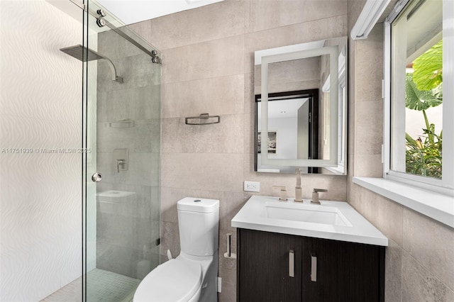 6784 SW 97th St, Pinecrest, FL 33156 - bathroom featuring tile walls, a stall shower, plenty of natural light, vanity, and toilet