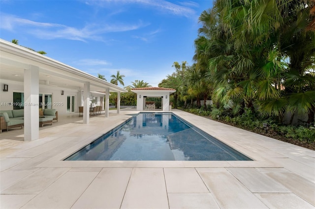 6784 SW 97th St, Pinecrest, FL 33156 - swimming pool featuring a patio area and an outdoor living space