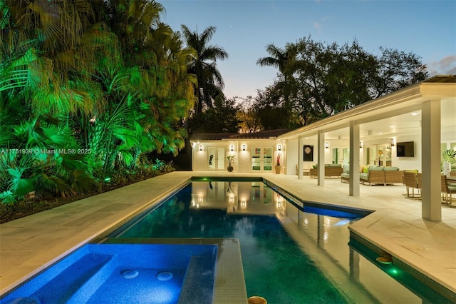 6784 SW 97th St, Pinecrest, FL 33156 - outdoor pool featuring a patio area, an outdoor hangout area, an in-ground hot tub, and french doors