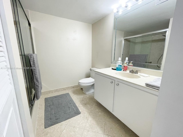 bathroom featuring baseboards, toilet, tile patterned flooring, vanity, and a shower stall