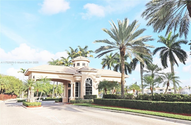 view of property featuring decorative driveway