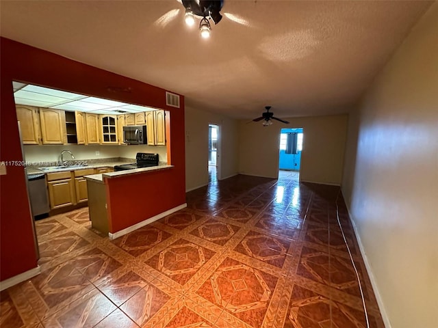 kitchen featuring a ceiling fan, dishwasher, glass insert cabinets, black range with electric cooktop, and a sink