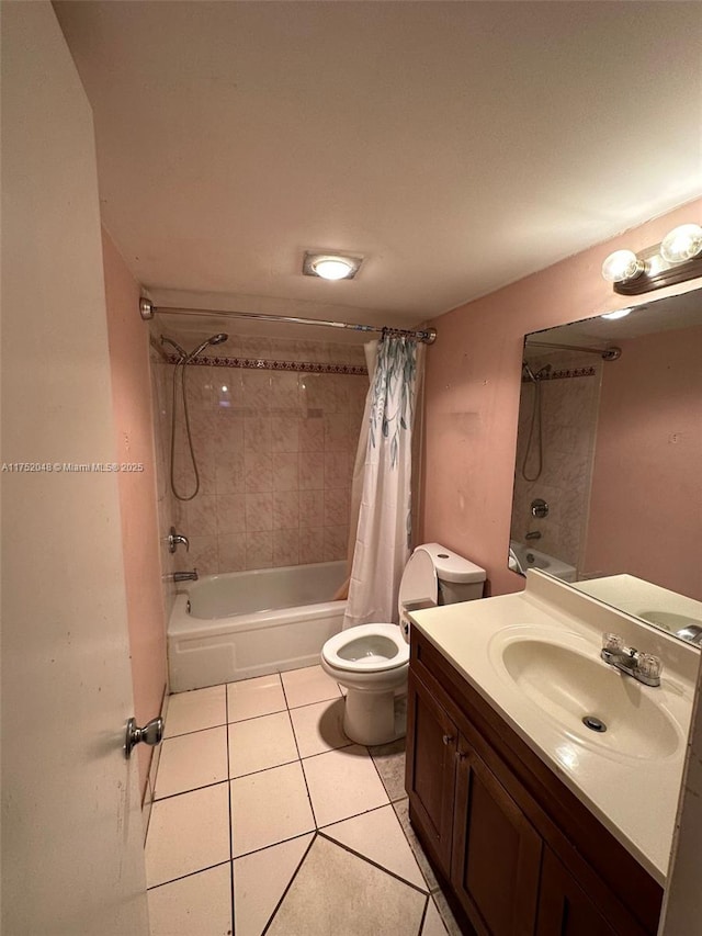 bathroom with tile patterned flooring, vanity, toilet, and shower / bath combo