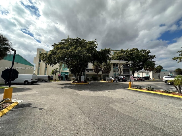 view of street with street lighting and curbs