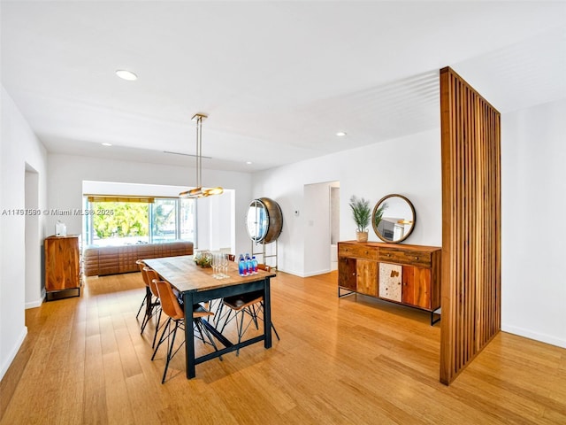 dining room featuring recessed lighting, light wood-style flooring, and baseboards