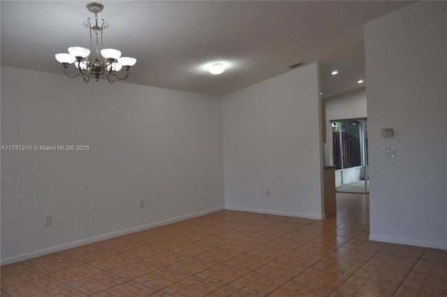 spare room featuring baseboards, visible vents, an inviting chandelier, a textured ceiling, and recessed lighting