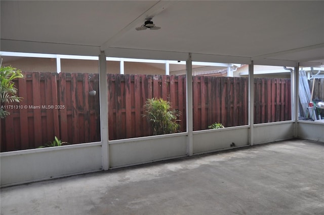 exterior space featuring fence and a ceiling fan