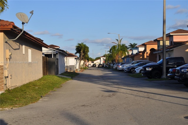 view of street with a residential view and street lights