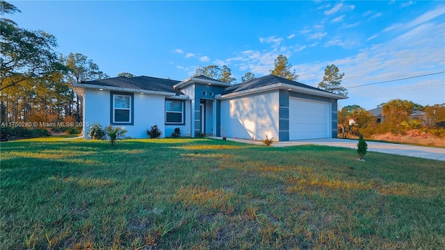 ranch-style house with an attached garage, driveway, a front lawn, and stucco siding