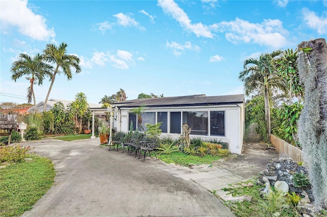 view of front of house featuring fence