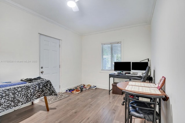 home office featuring ornamental molding, baseboards, and wood finished floors