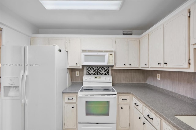 kitchen featuring white appliances, visible vents, and backsplash