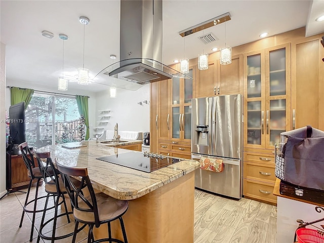 kitchen with island exhaust hood, glass insert cabinets, pendant lighting, and stainless steel fridge with ice dispenser