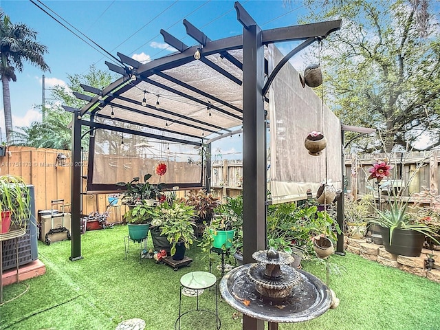 view of yard with a fenced backyard and a pergola